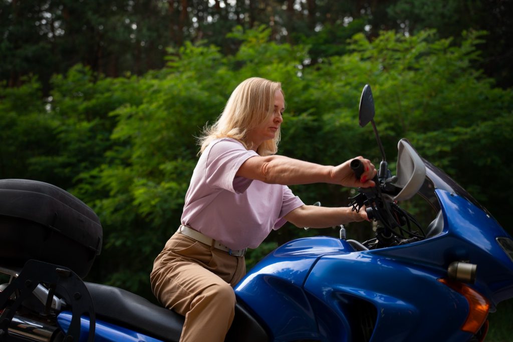 side view cool old woman with motorbike (1)