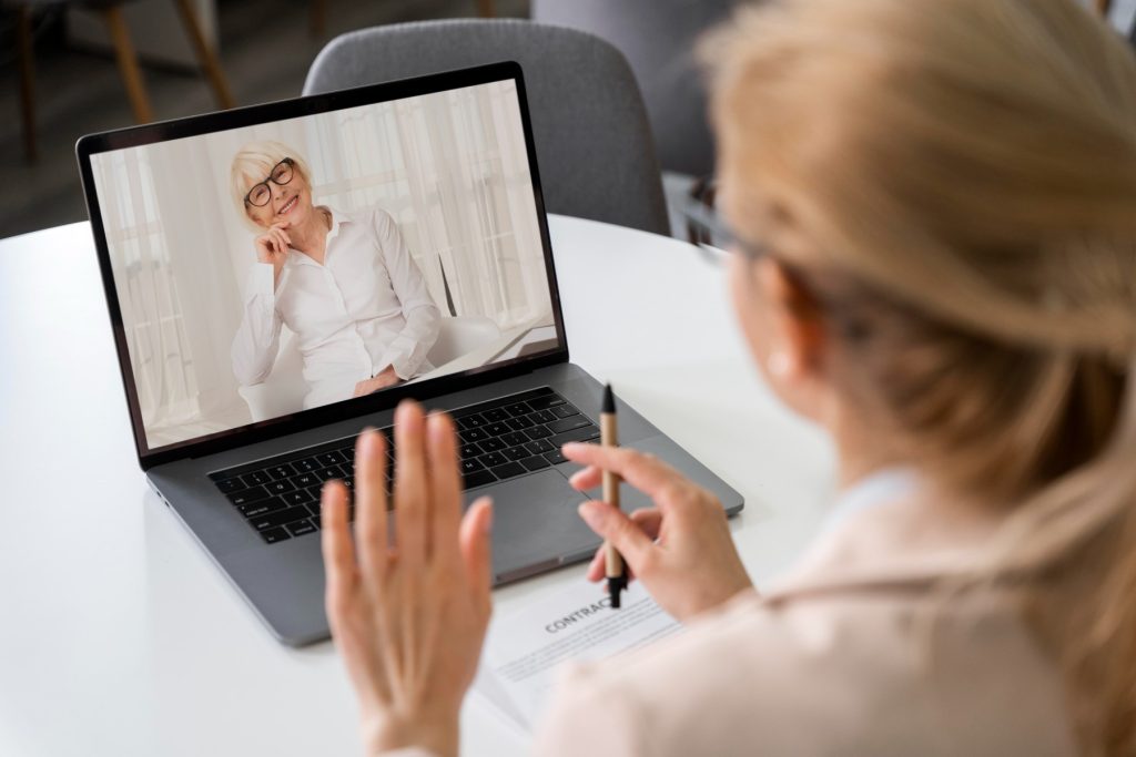 side view woman making video call (1)